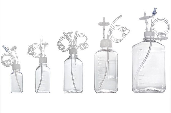 Media bottles with tubing assemblies